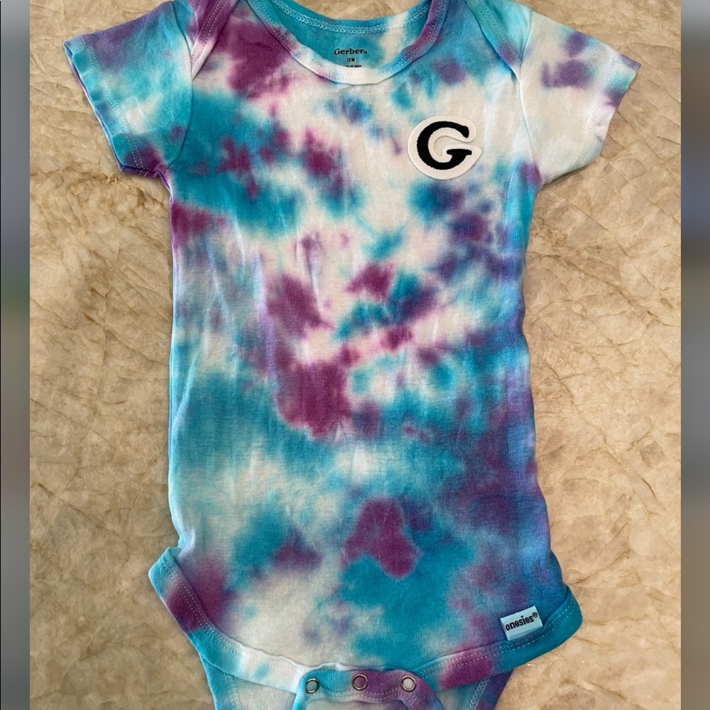 Custom tie dye and letter onesie